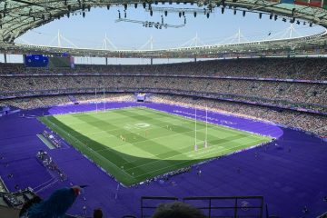 A large stadium filled with lots of people